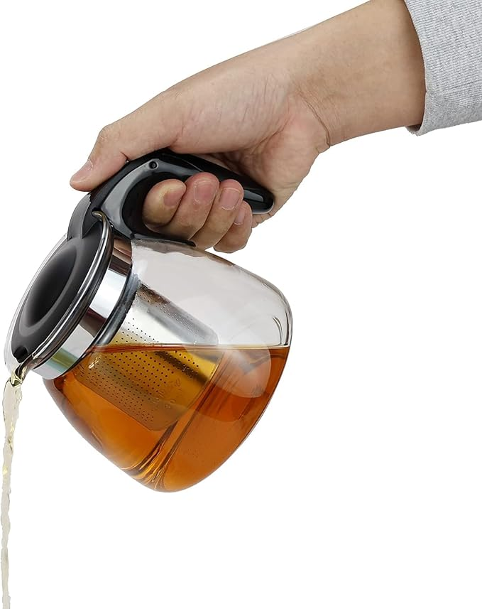 Tea being poured from a glass tea maker